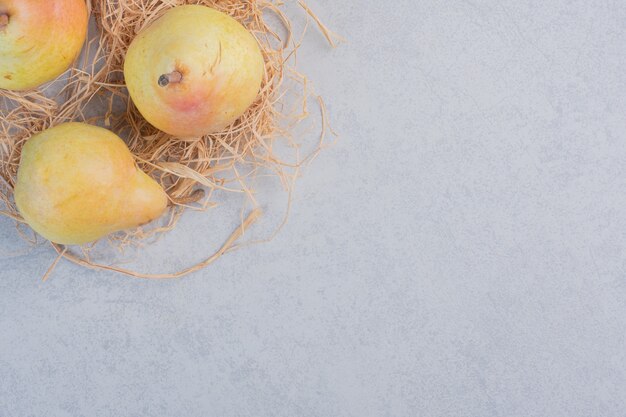 Organic fresh yellow pear on grey background. 