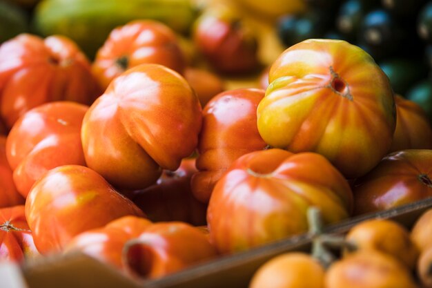 Organic heirloom tomatoes in display at a market