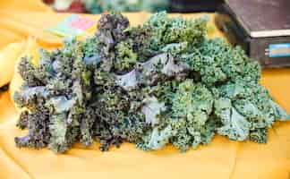 Free photo organic kale vegetable display at grocery store market