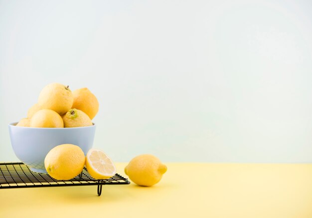 Organic lemons in a bowl with copy space