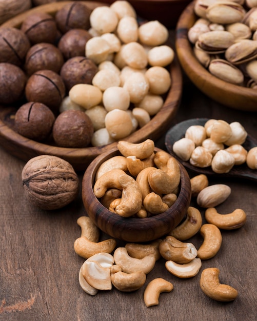 Organic nuts snack in bowls on wooden table