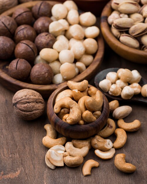 Organic nuts snack in bowls on wooden table