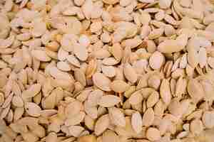 Free photo organic pumpkin seeds background