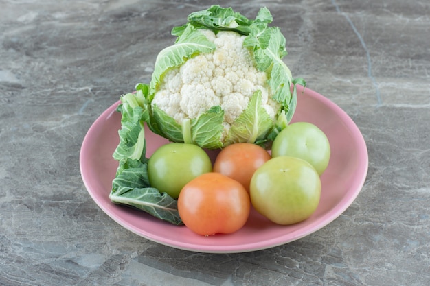 Organic vegetables. Cauliflower and unripe tomatoes. 