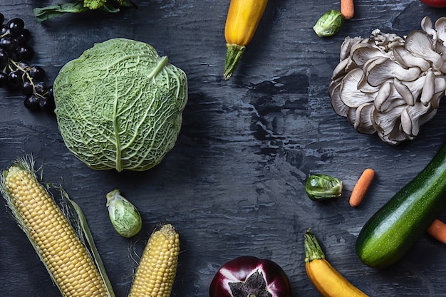 Free photo organic vegetables on wooden table. top view