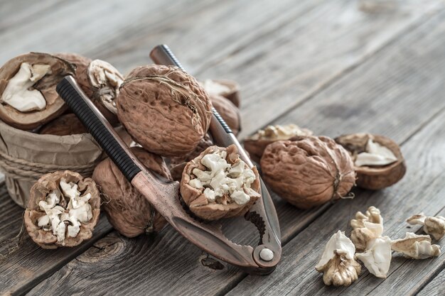 Organic Walnut lies on a wooden wall , close-up .