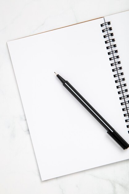 Organised arrangement of desk elements on white background