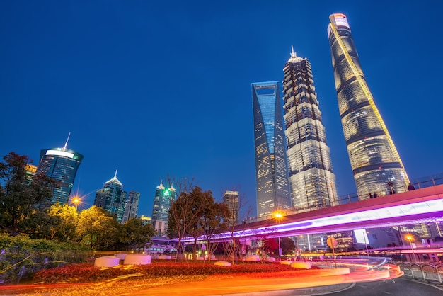 Oriental pearl tv tower and commercial buildings located in the lujiazui financial district at night, shanghai,china