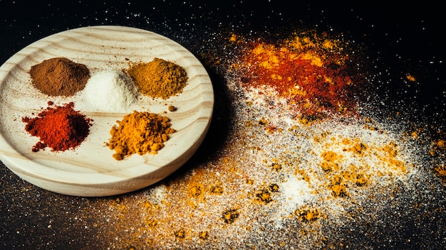 Oriental spices on wooden plate