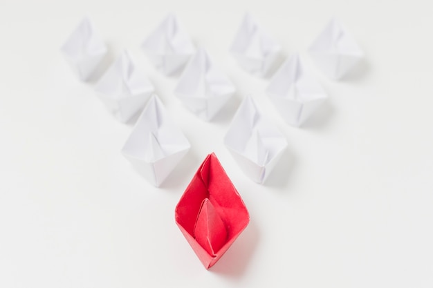 Free photo origami boats leadership concept