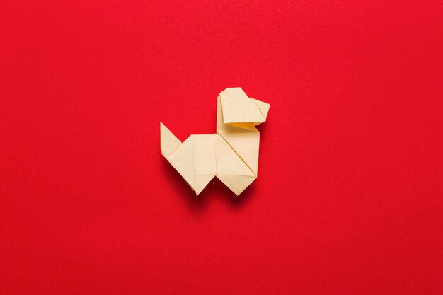 Origami dog on red