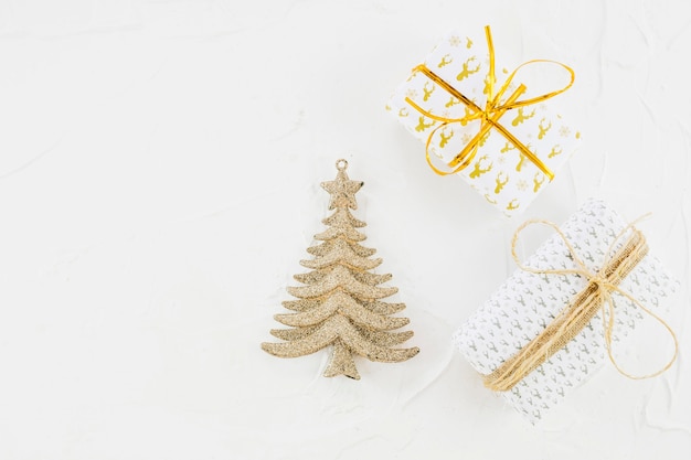 Ornament fir tree near gift boxes