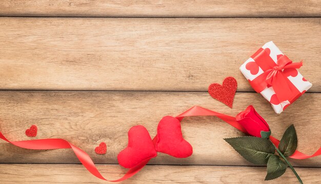 Ornament hearts near flower and present box 