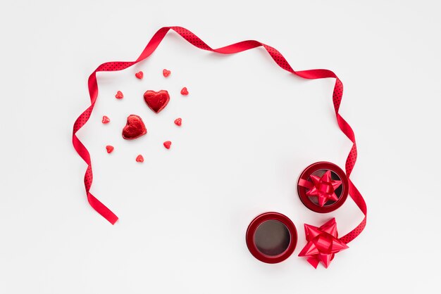 Ornament hearts near ribbon and bows 