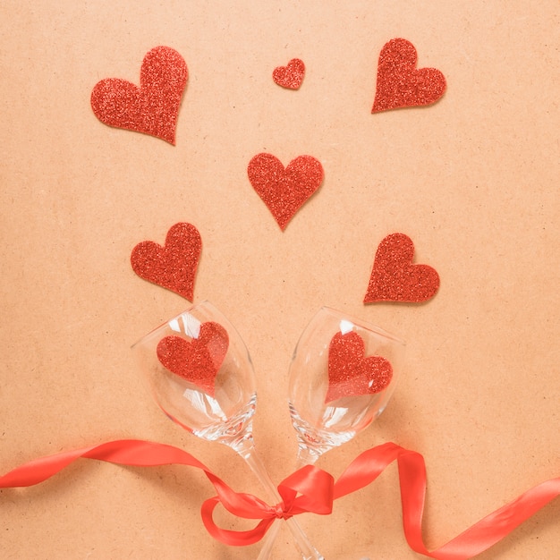 Free photo ornament hearts and wine glasses with ribbon