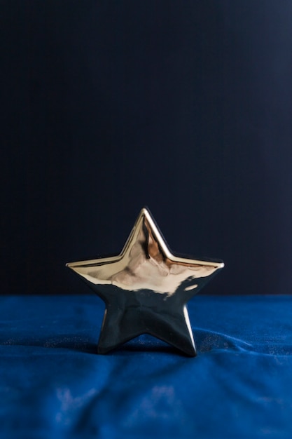 Ornament star on blue bed sheet