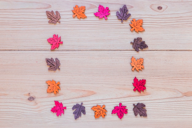 Ornamental leaves on wood board 