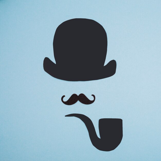 Ornamental mustache near paper pipe and top hat