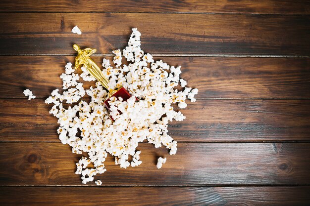 Oscar statuette lying in popcorn