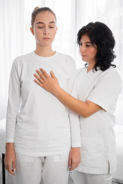 Osteopathist treating a girl at the hospital