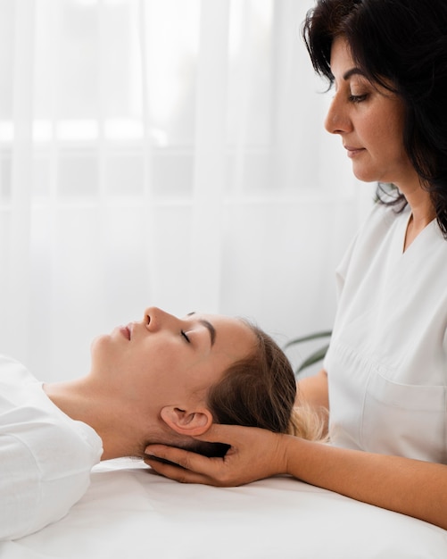 Osteopathist treating a patient indoors