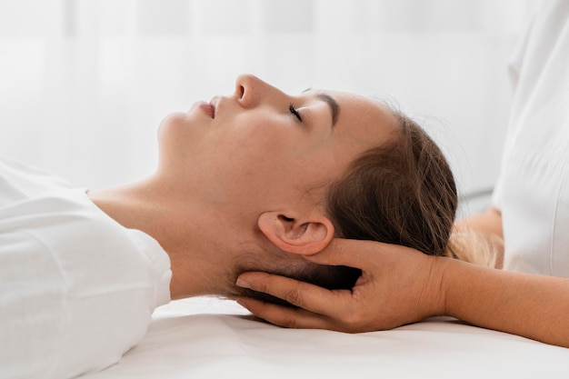 Osteopathist treating a patient indoors