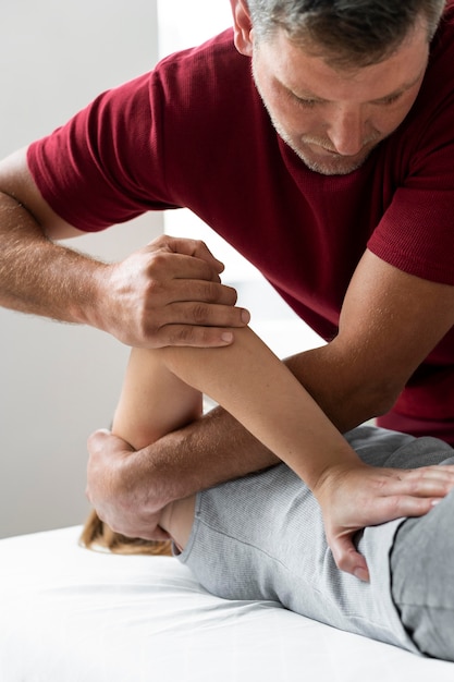 Free photo osteopathy patient getting treatment massage