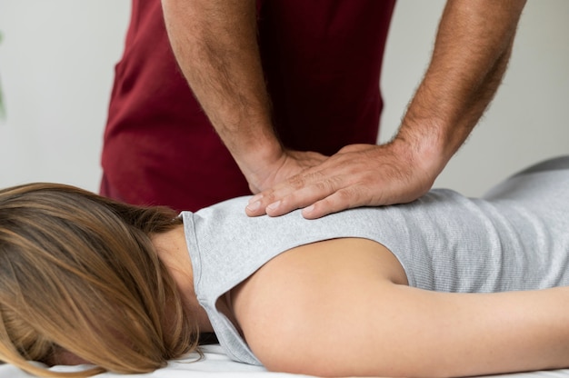 Free photo osteopathy patient getting treatment massage