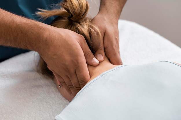 Free photo osteopathy patient getting treatment massage