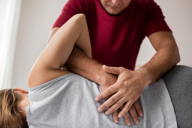 Free photo osteopathy patient getting treatment massage