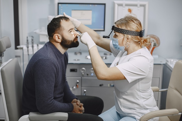 Otolaryngologist preparing for the medical examination procedure