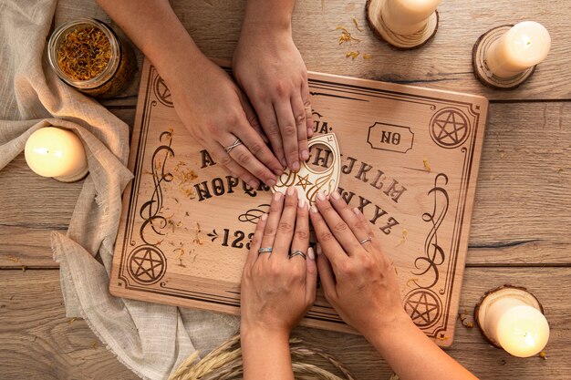 Ouija board and candles arrangement above view