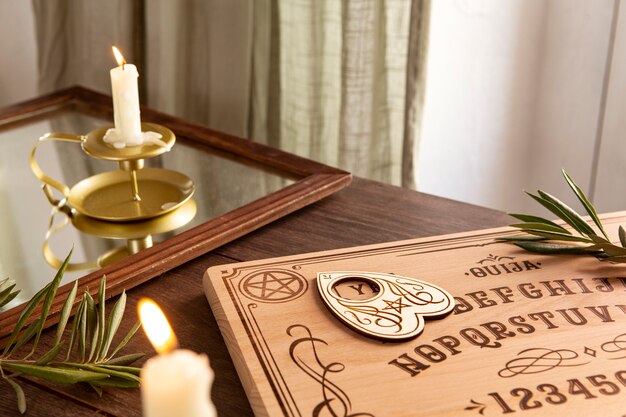 Ouija board and leaves high angle