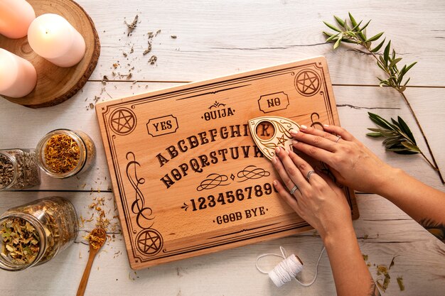 Ouija board on wooden table above view