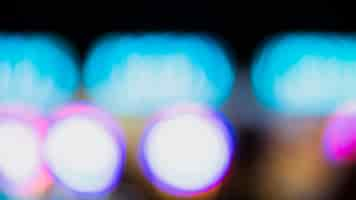 Free photo out-of-focus colorful bokeh neon lights