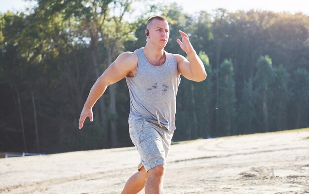 Outdoor cross-country running in early sunrise concept for exercising, fitness.