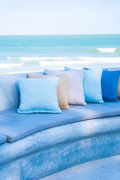 Outdoor patio in the beach with sofa and pillows