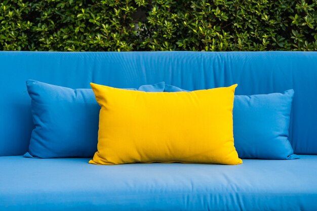 Outdoor patio in the garden with sofa and pillows