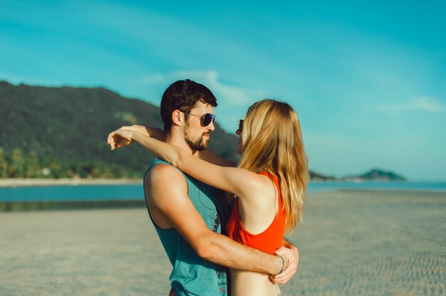 Outdoor portrait of beautiful traveling couple