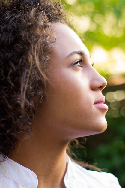 Outdoor Portrait of beautiful young woman posing