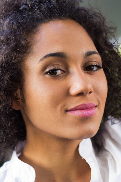 Outdoor Portrait of beautiful young woman posing