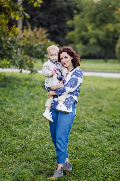 Outdoor portrait of a happy family enjoying the fall season