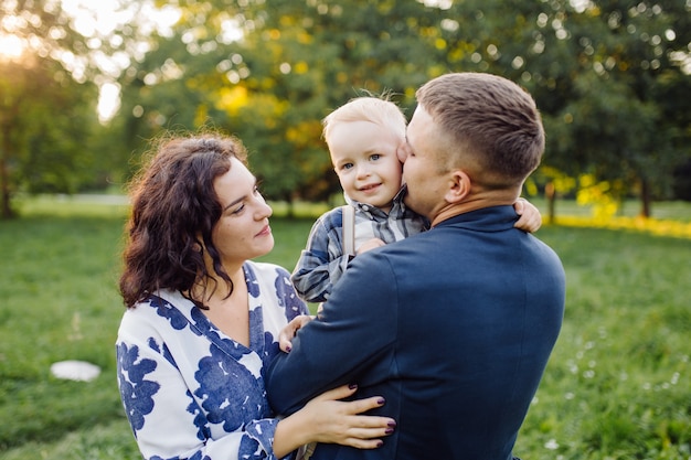 Outdoor portrait of a happy family enjoying the fall season