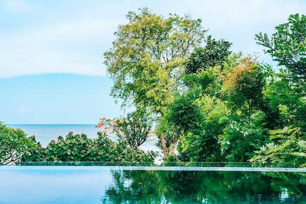 Outdoor swimming pool in hotel and resort neary sea and beach