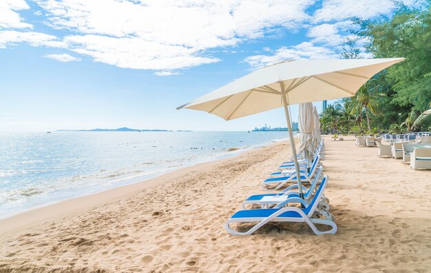Outdoor with umbrella and chair on beautiful tropical beach and sea
