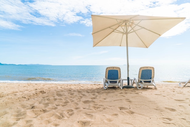 Outdoor with umbrella and chair on beautiful tropical beach and sea