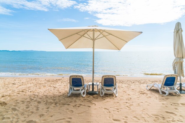 Outdoor with umbrella and chair on beautiful tropical beach and sea