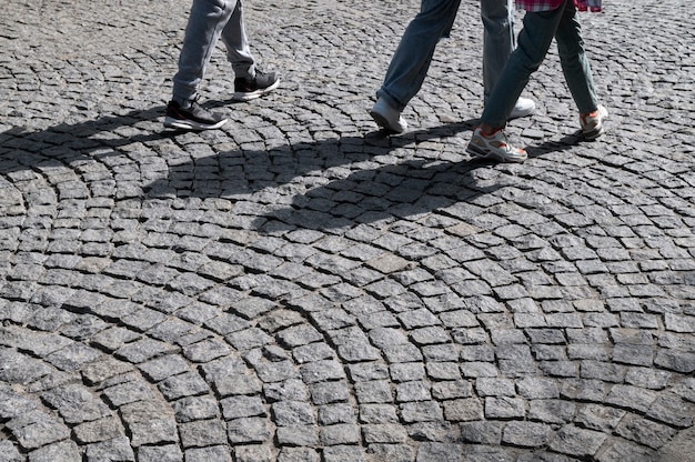 Outdoors cobblestone texture with pedestrians