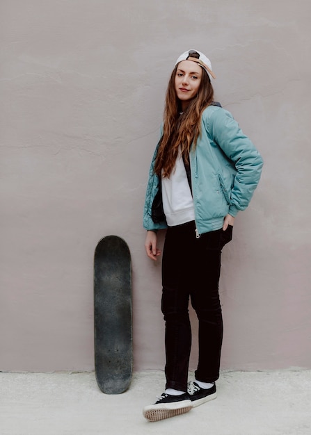 Outdoors skater girl and her skateboard