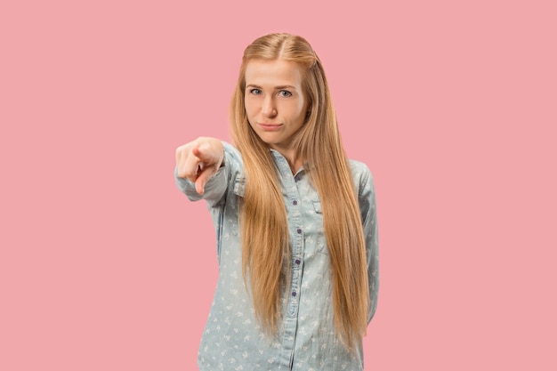 The overbearing business woman point you and want you, half length closeup portrait on pink.